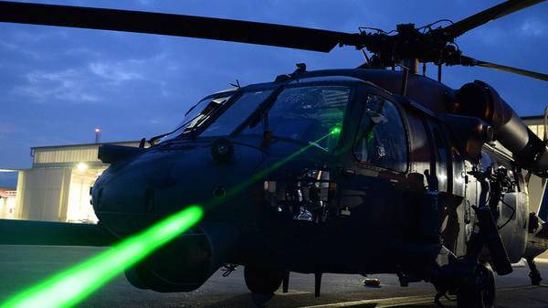 Helicopter with green light shining out of window