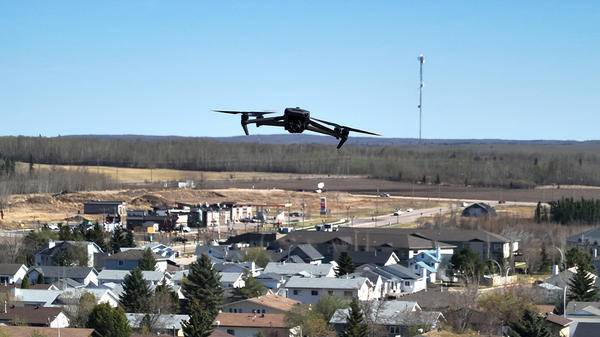 Drone flying above town