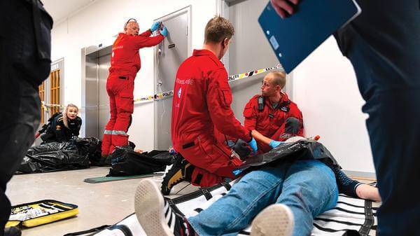 Paramedics treating patient