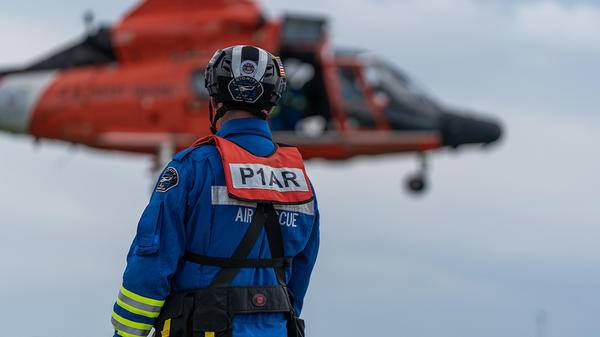 P1AR rescue worker waiting for helicopter to land