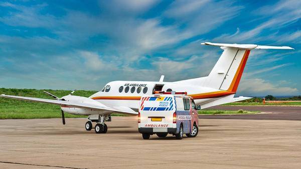 Airmed plane parked next to ambulance