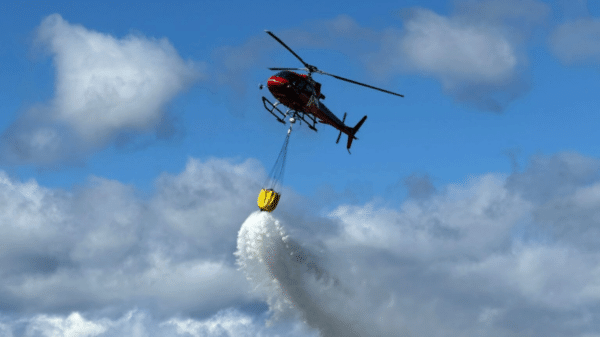 Airbus H125 dropping water with Caurus Sensor attached