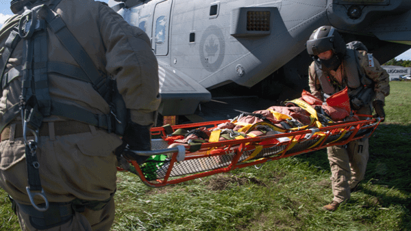 Man being stretchered into helicopter