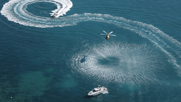 helicopter and boat in the sea