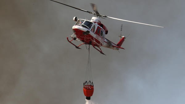 Helicopter dropping fire retardant