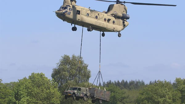 Helicopter lifting up van