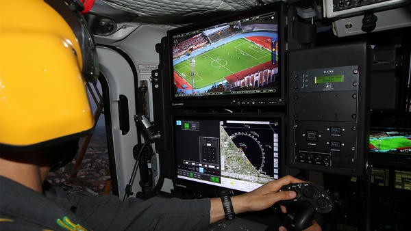 Helicopter pilot looking into football stadium from above in Italy