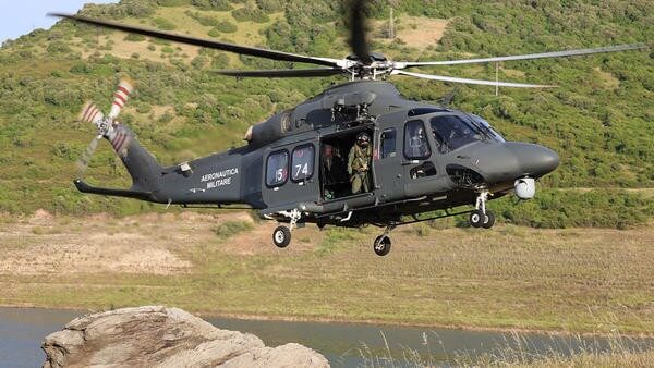 Military helicopter flying close to ground