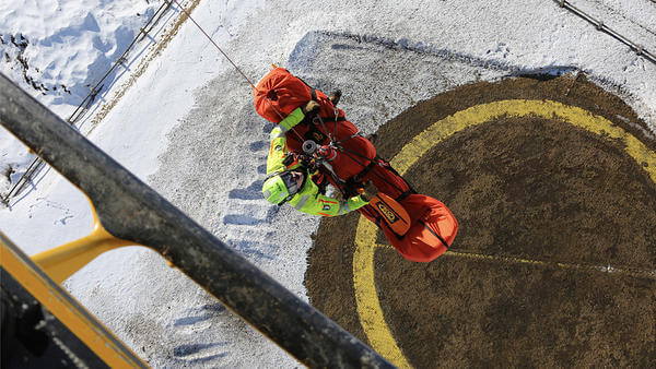 Guy hoisted out of helicopter
