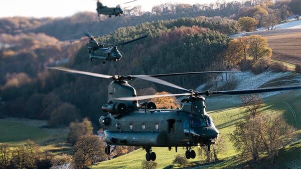 Helicopter flying by the countryside
