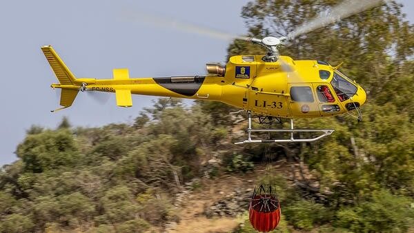 Helicopter with water bucket