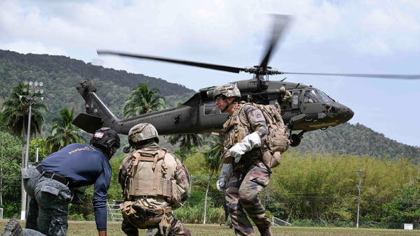 Military and police in helicopter training action