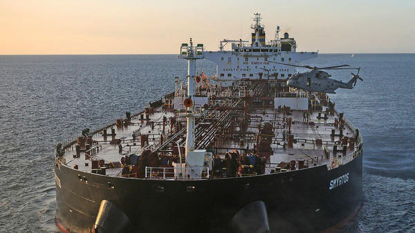 Helicopter flying next to ship
